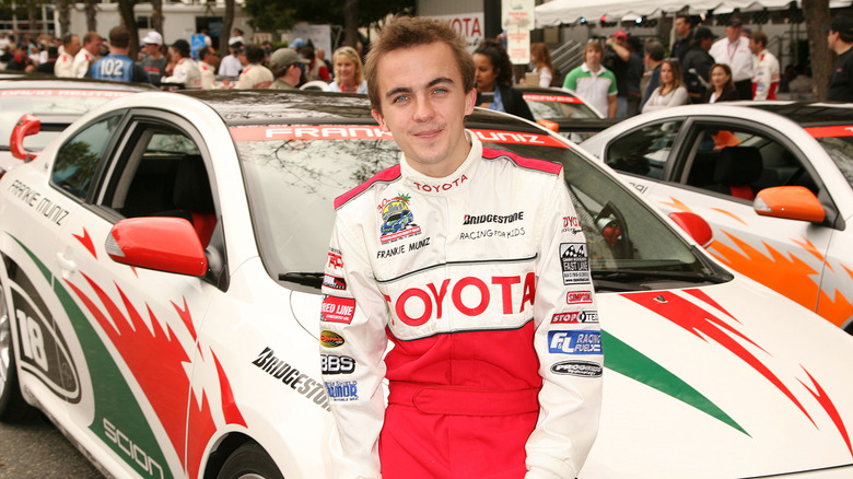 Frankie Muniz posing with car during the 2004 Toyota Pro/Celebrity race