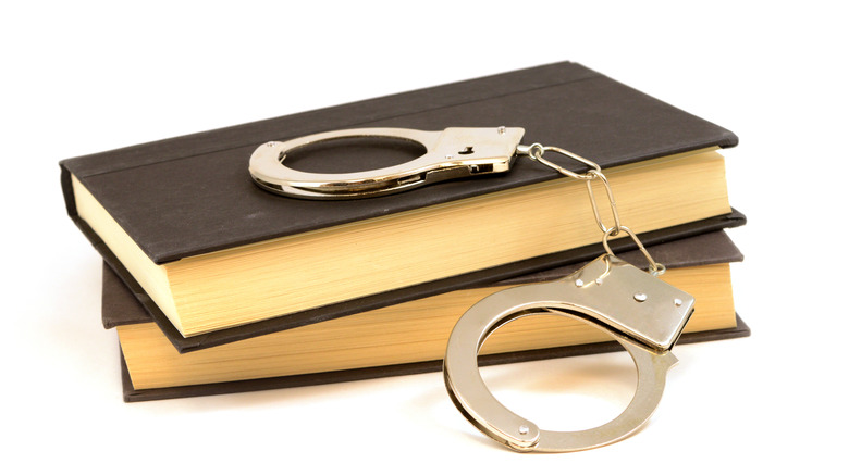 handcuffs with book