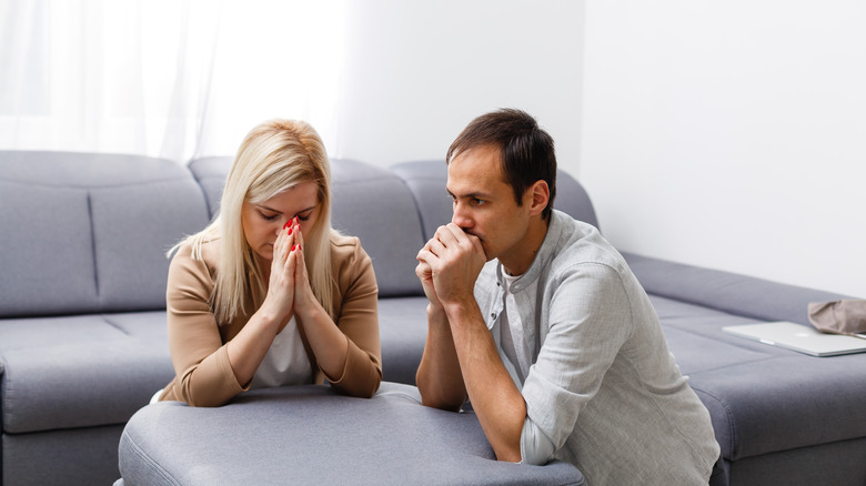 Woman and man praying