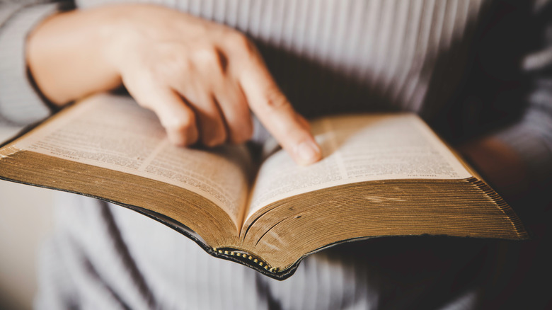 woman holding a bible