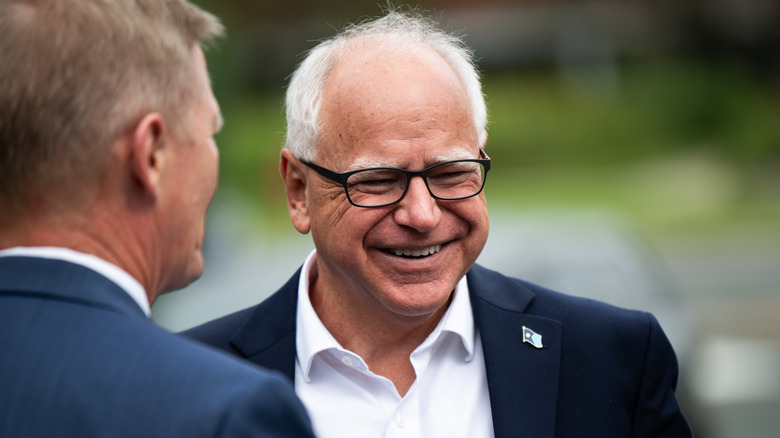 Tim Walz smiling while talking