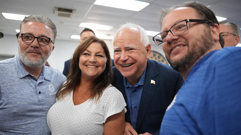 Time Walz posing with audience members