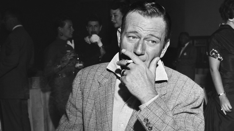 John Wayne smoking a cigarette