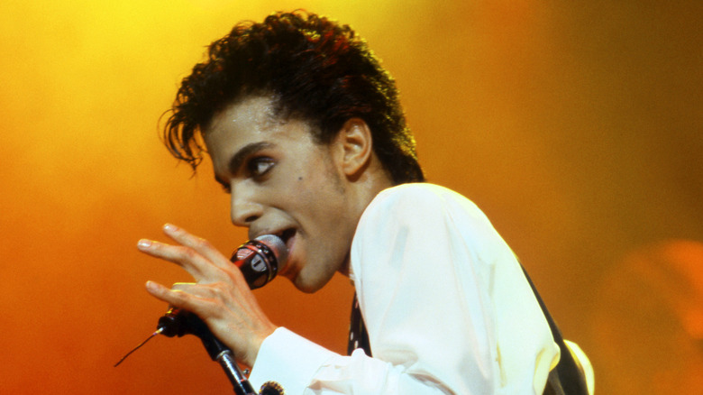 Prince onstage with microphone
