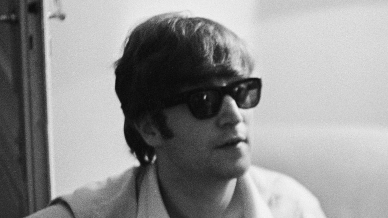 John Lennon playing guitar