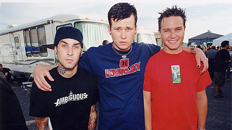 Tom Delong and the other members of Angels and Airwaves standing together