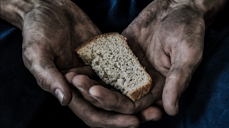 Dirty hands with bread