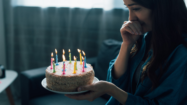 sad girl with birthday cake