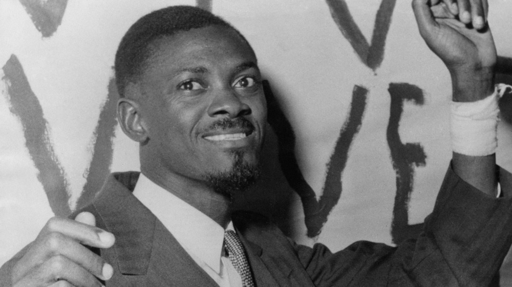 Patrice Lumumba with hands raised