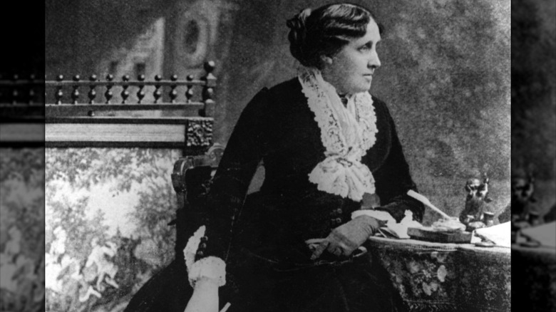 Louisa May Alcott at desk