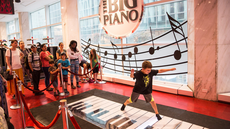 Boy playing on Big Piano FAO Schwarz