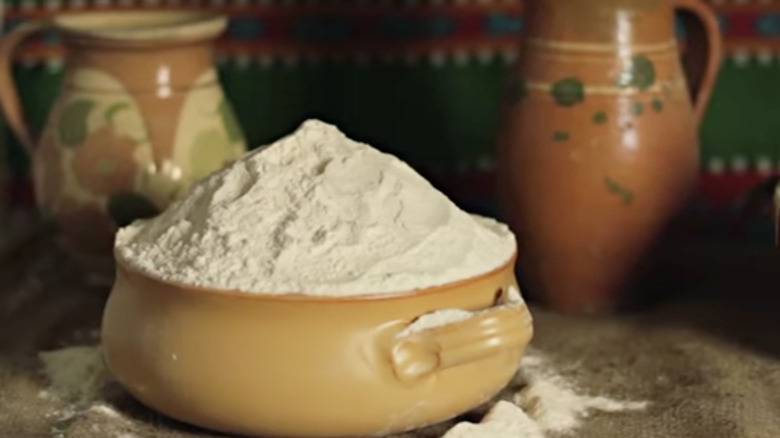 milk powder in a rough-hewn pottery piece