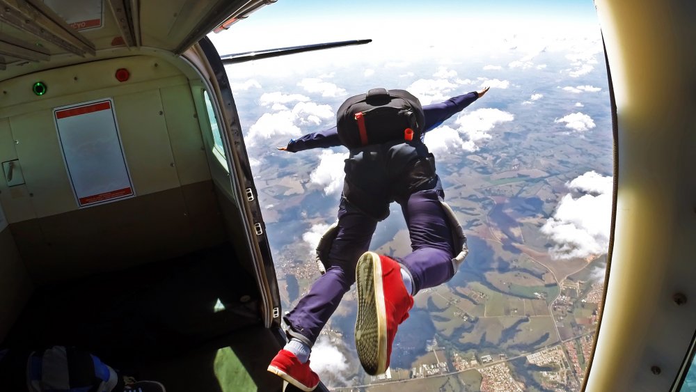 Skydiver jumping out of plane