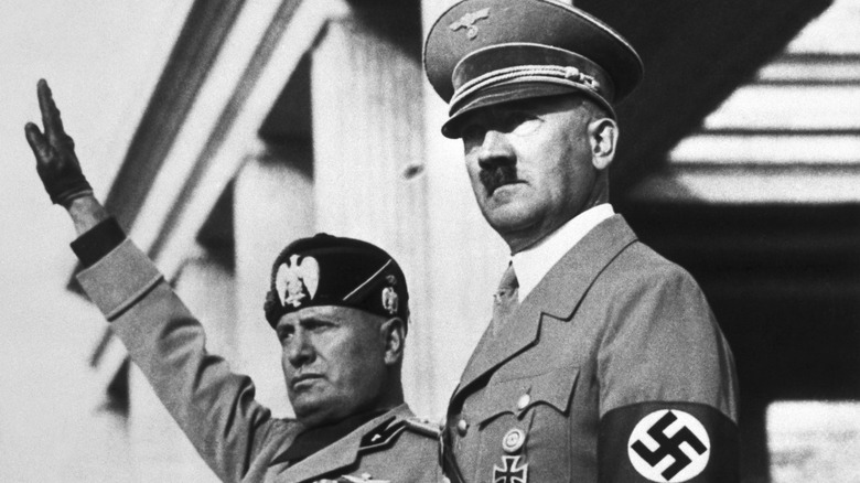 Mussolini and Hitler standing before crowd