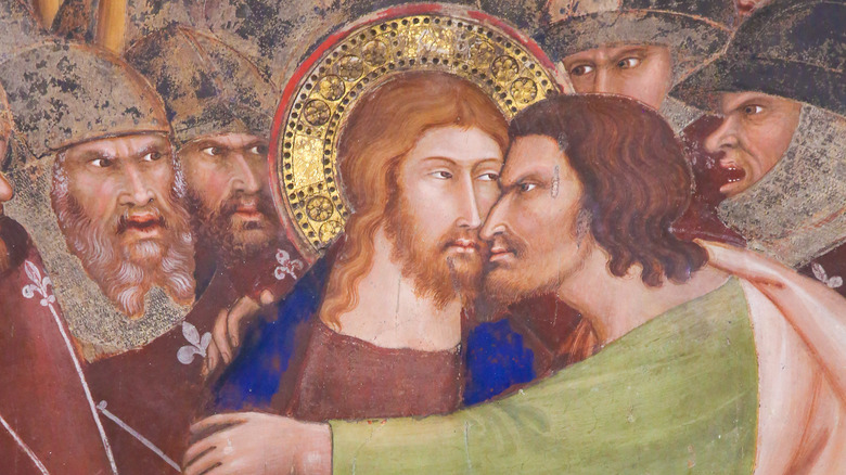 Judas betraying Jesus with a kiss