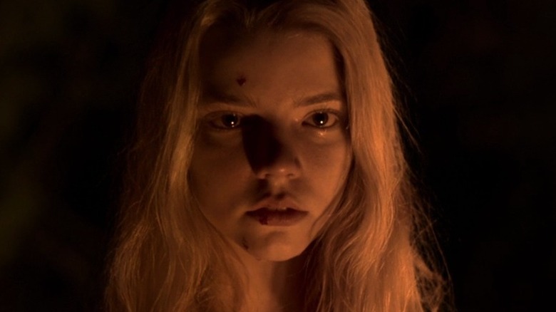 Anya Taylor Joy face in firelight