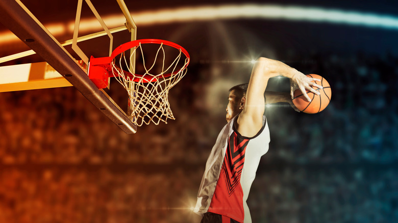 Basketball player leaping to the hoop 