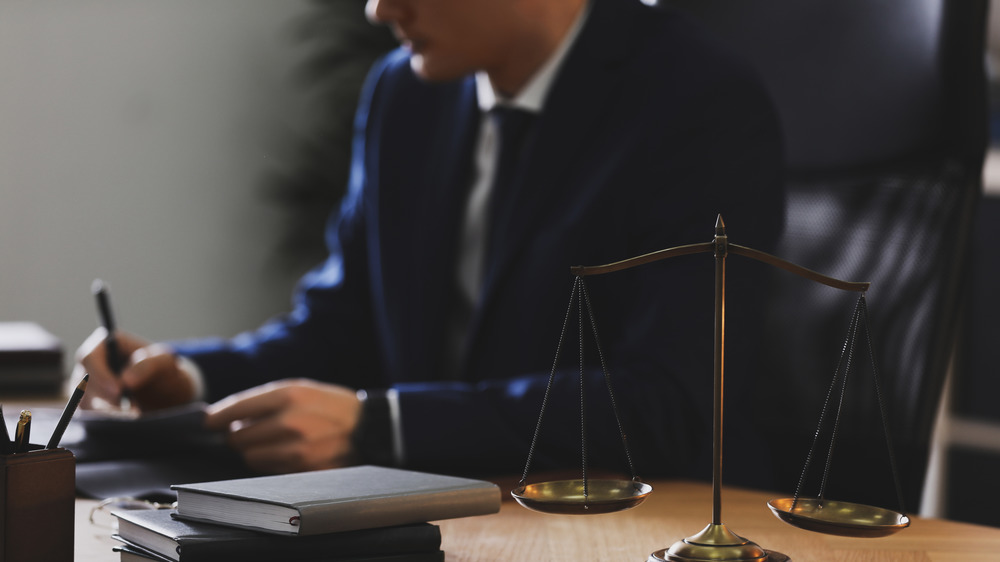 Lawyers debating a case around a table