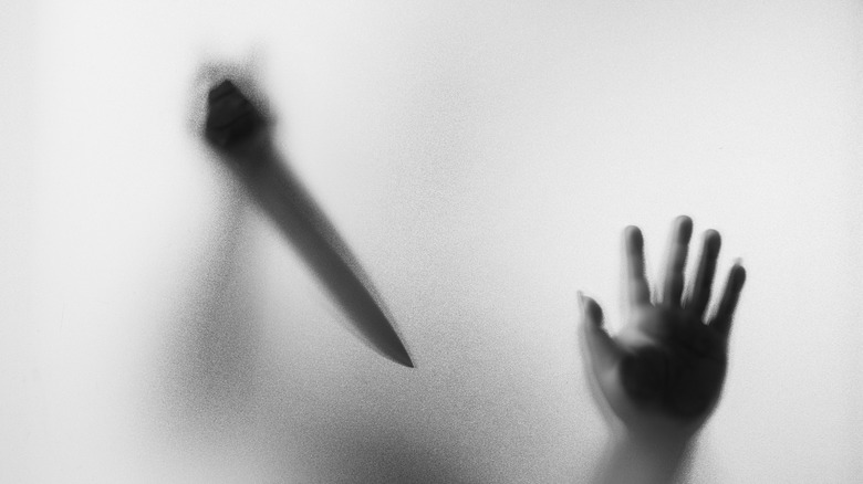 hand with knife