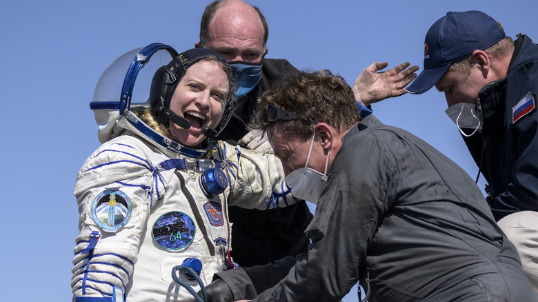 astronaut Kate Rubins waving