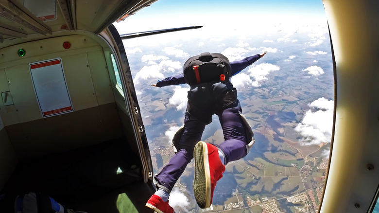 Person jumping out of plane