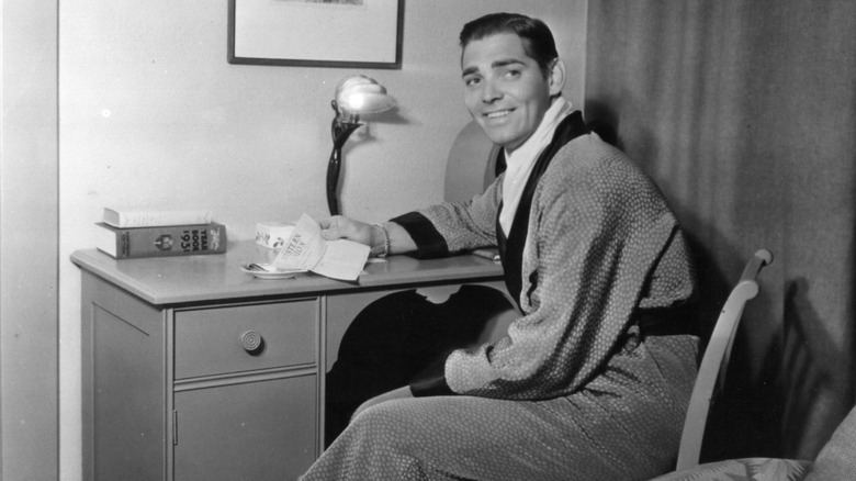 Clark Gable sitting in dressing room