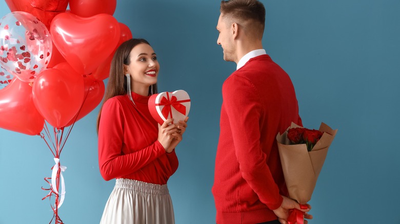 couple exchanging gifts for valentine's day