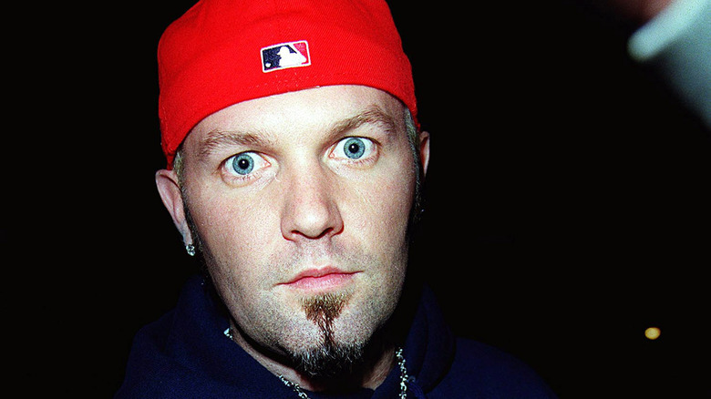 Fred Durst wearing red backward ball cap