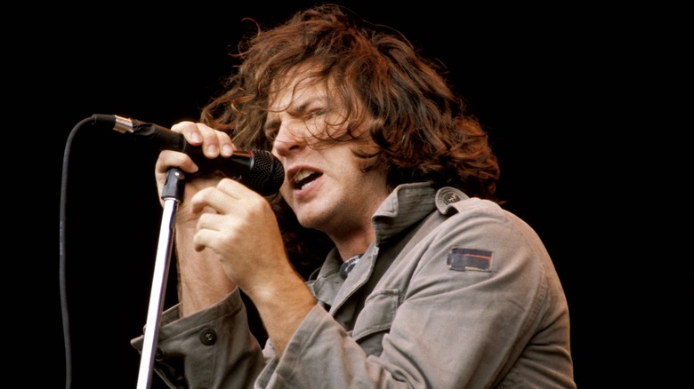 Eddie Vedder of Pearl Jam singing into a microphone