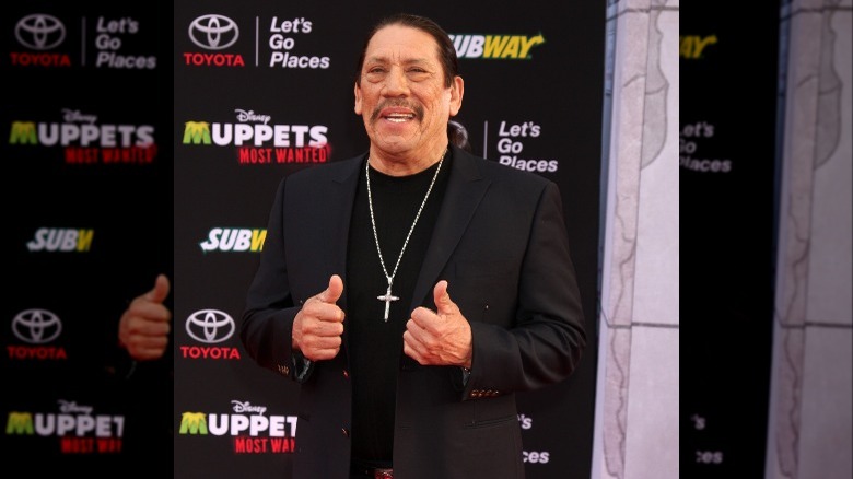 Danny Trejo holding two thumbs up