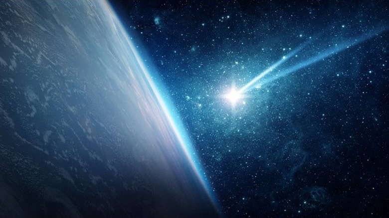 Meteorite hitting Earth, starry background