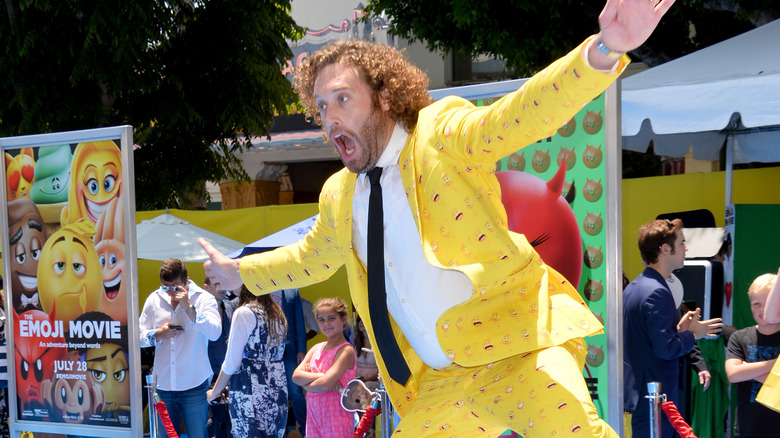 TJ Miller jumping into the air