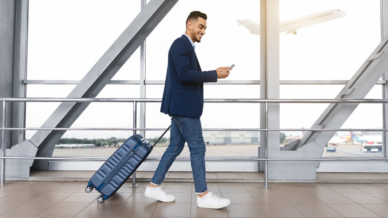 guy looking at smartphone and departing death