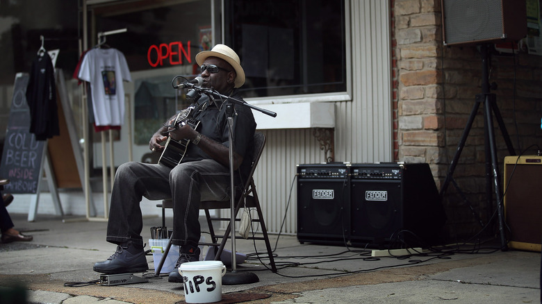 A man plays blues in Muddy Waters' hometown