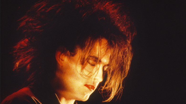 Robert Smith performing on stage 