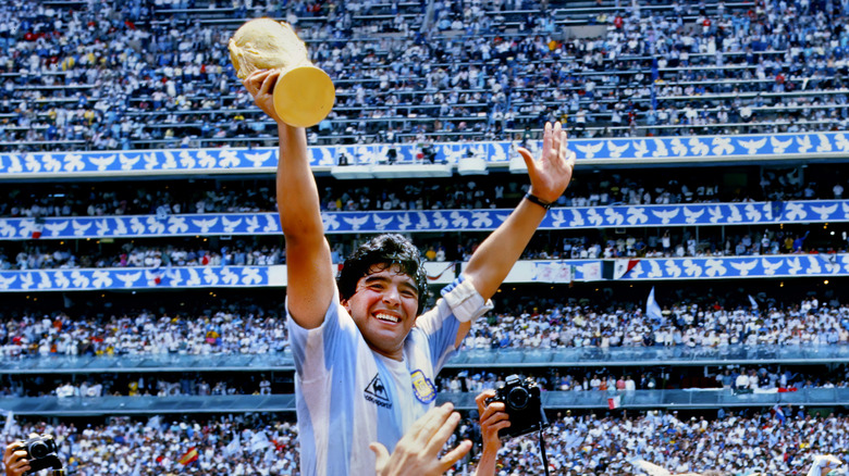 Diego Maradona holding World Cup 