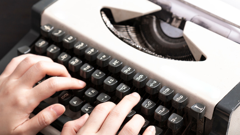 Hands on typewriter