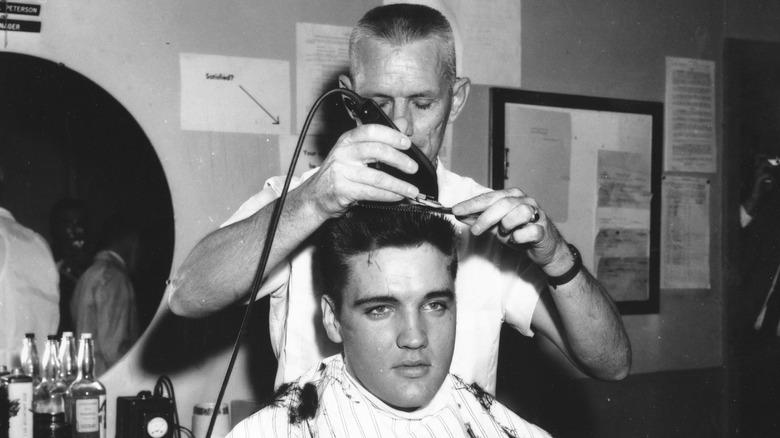 Elvis getting a military haircut