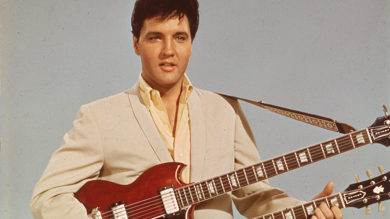 Elvis Presley with guitars