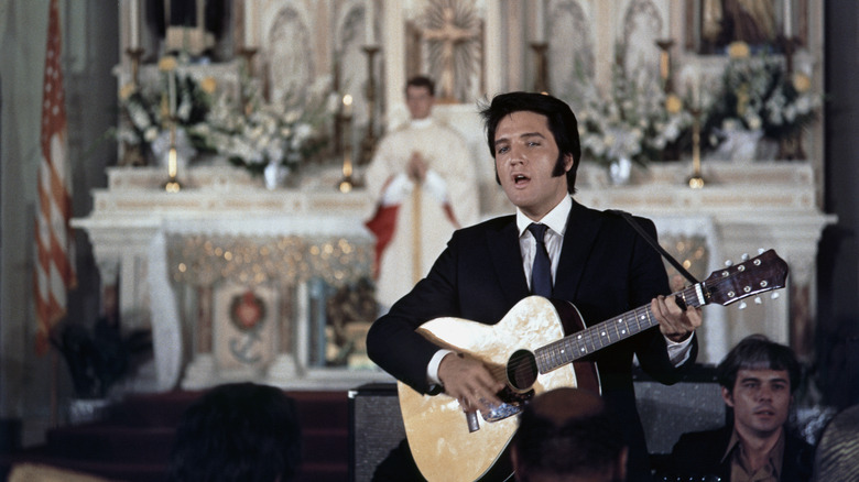 Elvis Presley playing guitar in church