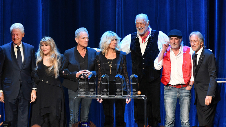 Bill Clinton with Fleetwood Mac smiling