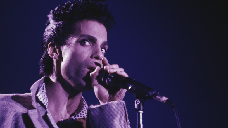 Prince singing into microphone