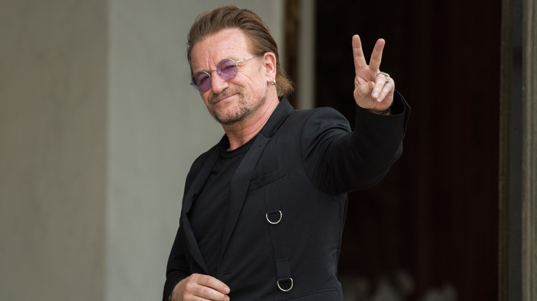 Bono giving peace sign