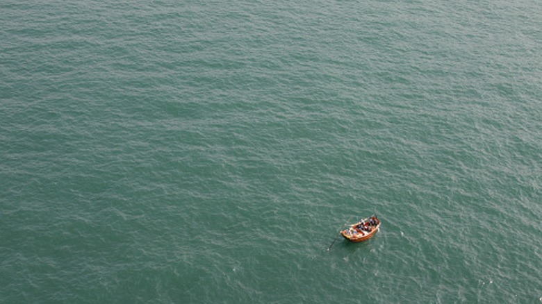 Small boat in a big sea