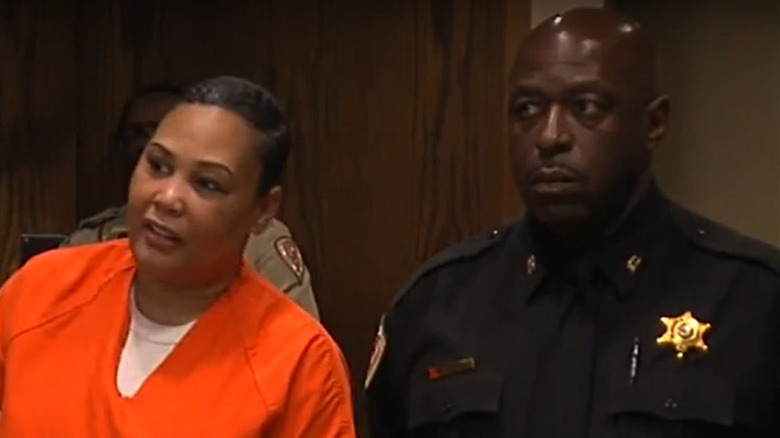 Sherra Brown stands in court