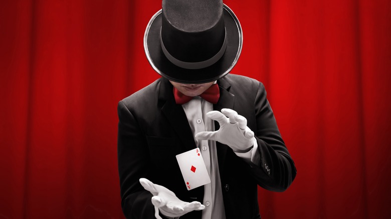 magician performing card trick