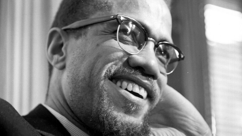 Malcolm X smiles