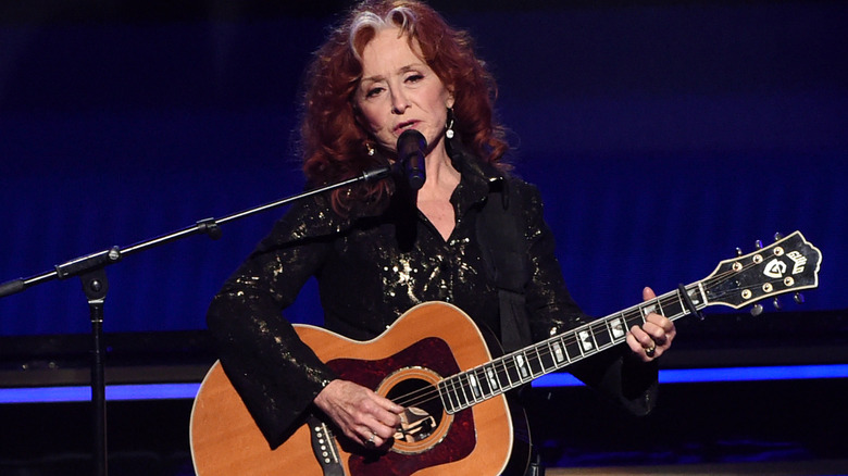 Bonnie Raitt guitar blue background