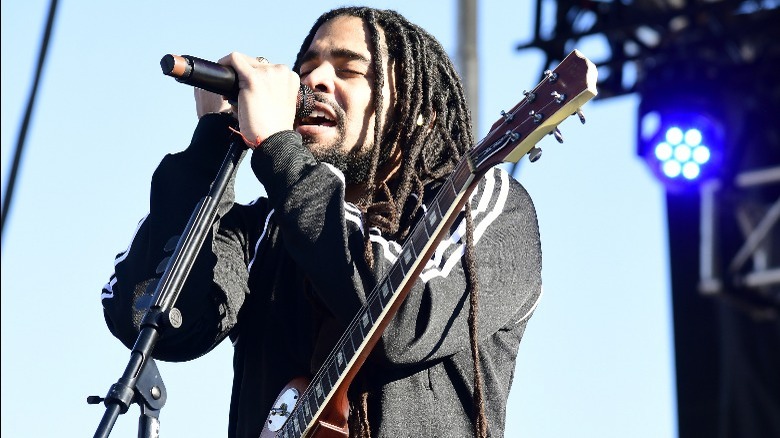 Skip Marley singing into microphone