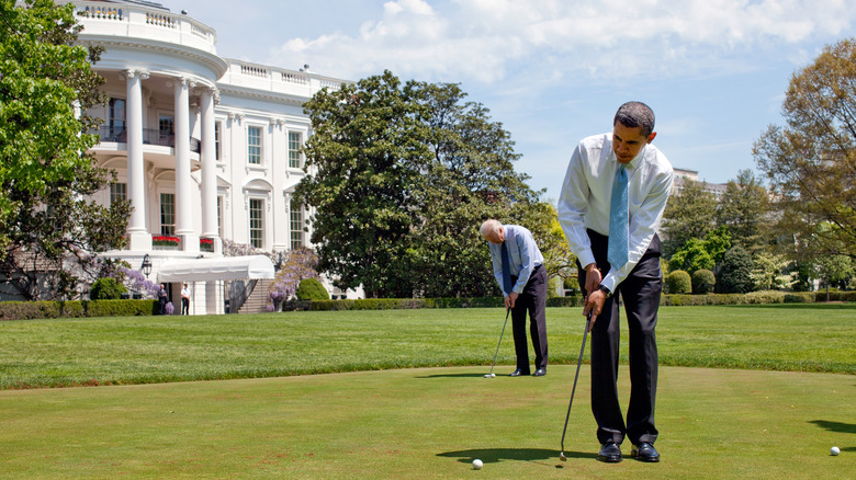 Former President Barack Obama and his Vice President Joe Biden enjoy the White House putting green